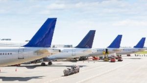 four-jet-aircraft-tails-at-airport-blue