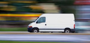 White cargo van at speed