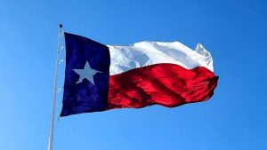 Texas flad on a sunny day waving against a blue sky background